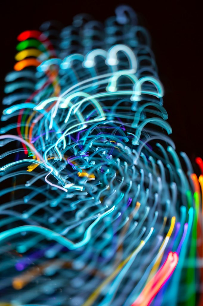 VisionThinks_Aachen_a-blurry-photo-of-neon-lights-in-the-dark